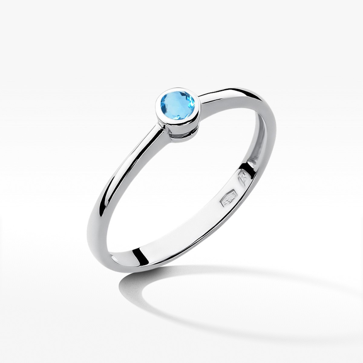Pierścionek z białego złota z topazem Swiss - próba 585 0,15CT w0224.B3.TOB.02