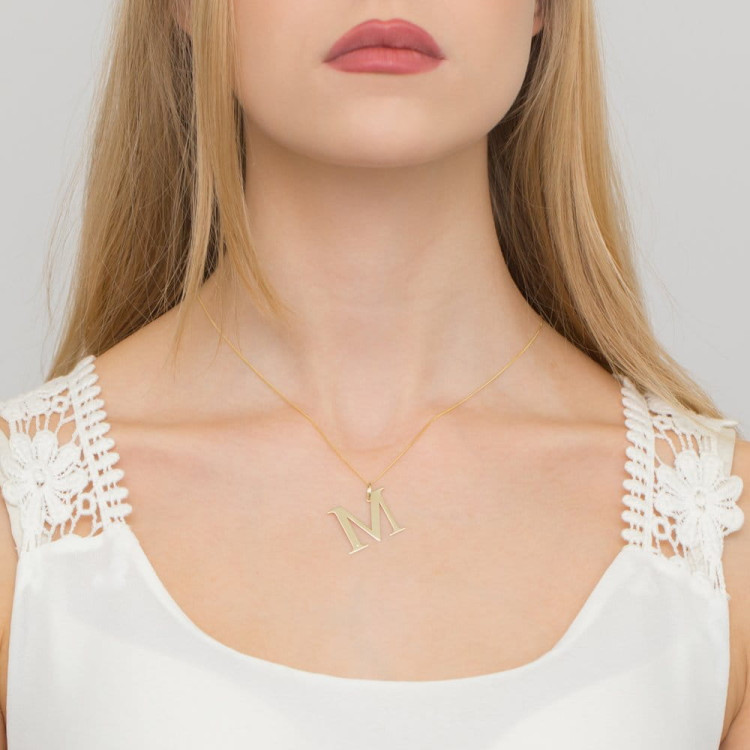 Zawieszka z żółtego złota z diamentem - próba 585 0,005CT LITERKA M