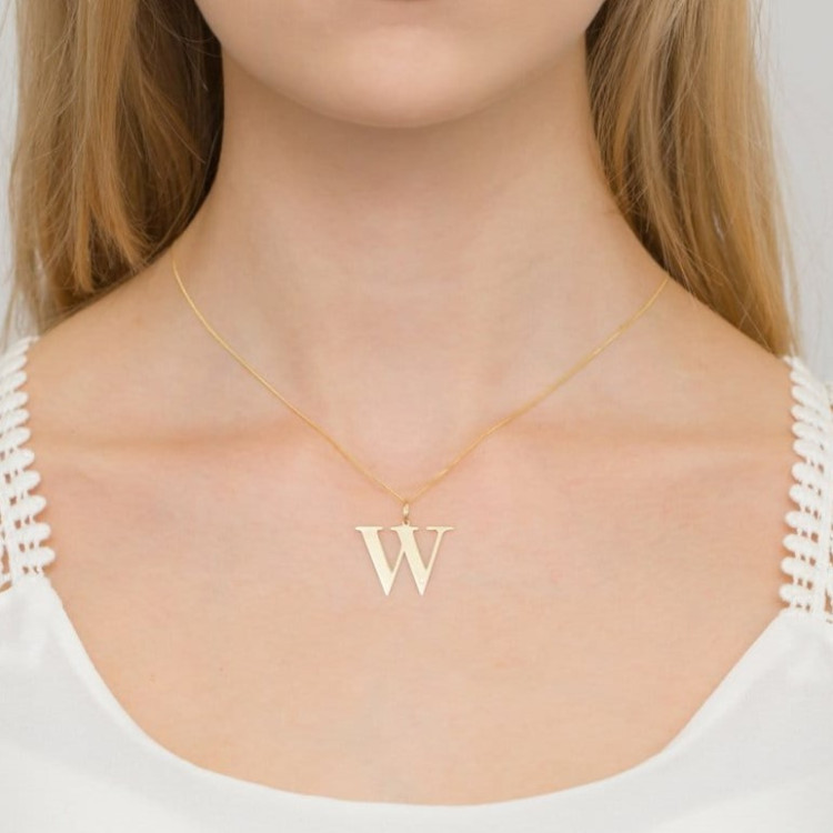 Zawieszka z żółtego złota z diamentem - próba 585 0,005CT LITERKA W